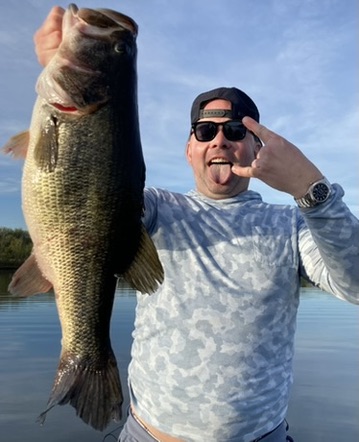 Angler showing off a trophy largemouth bass